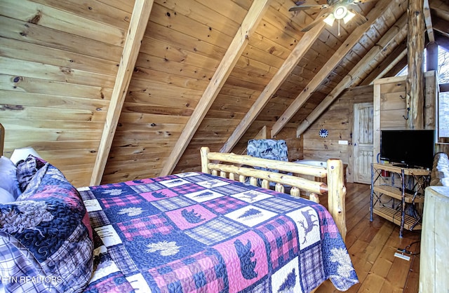 bedroom with wood-type flooring, vaulted ceiling with beams, wood ceiling, and wood walls