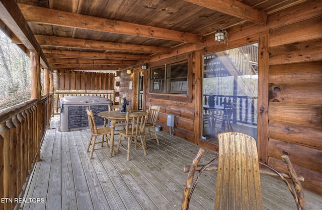 wooden terrace with a jacuzzi