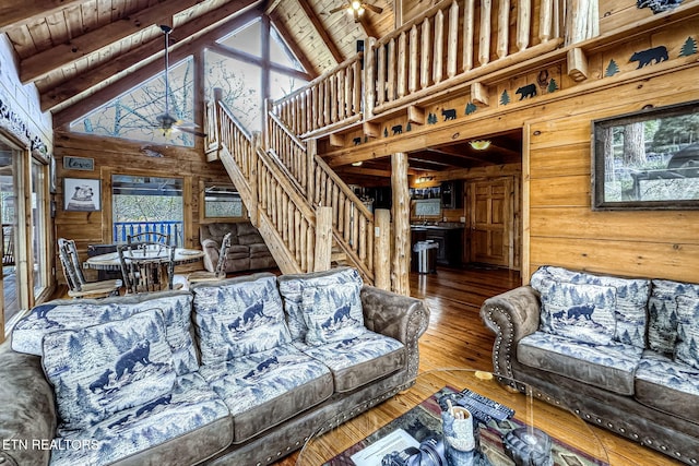 living room with beam ceiling, hardwood / wood-style floors, wood ceiling, and ceiling fan