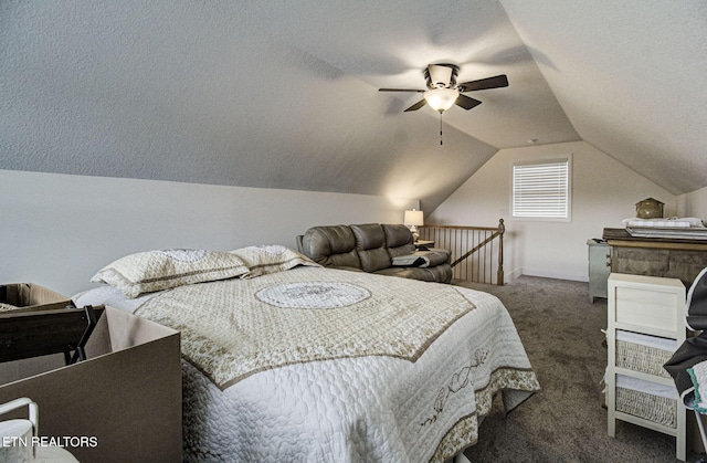 bedroom with vaulted ceiling, ceiling fan, dark colored carpet, and a textured ceiling