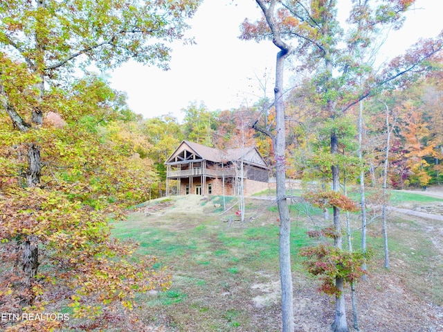 617 Cheyenne Dr, Jamestown, TN 38556 - view of front of home with a wooden deck, a front yard, and a wooded view
