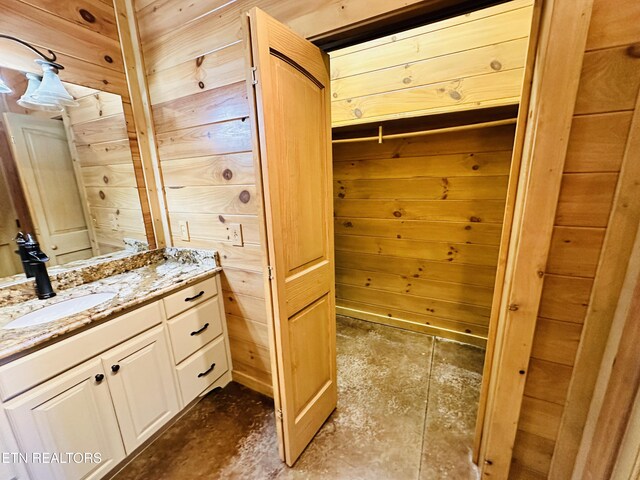 617 Cheyenne Dr, Jamestown, TN 38556 - bathroom featuring vanity, wooden walls, and concrete flooring