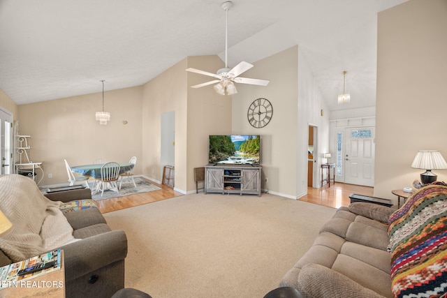 carpeted living room with baseboards, high vaulted ceiling, and ceiling fan