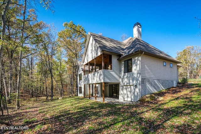 view of home's exterior featuring a yard and a patio area