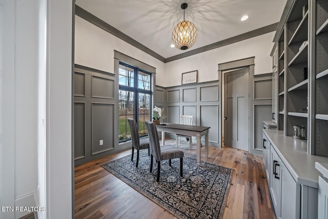 office space with ornamental molding, dark hardwood / wood-style floors, and a chandelier