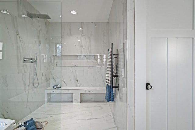 bathroom with a tile shower