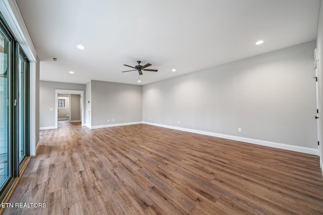 unfurnished room with ceiling fan and light hardwood / wood-style flooring