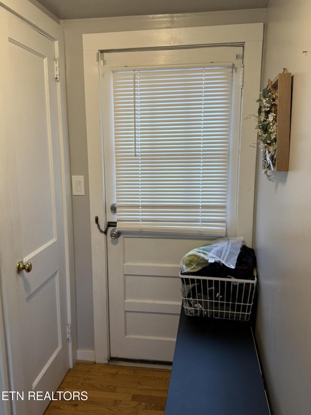 doorway to outside featuring wood finished floors