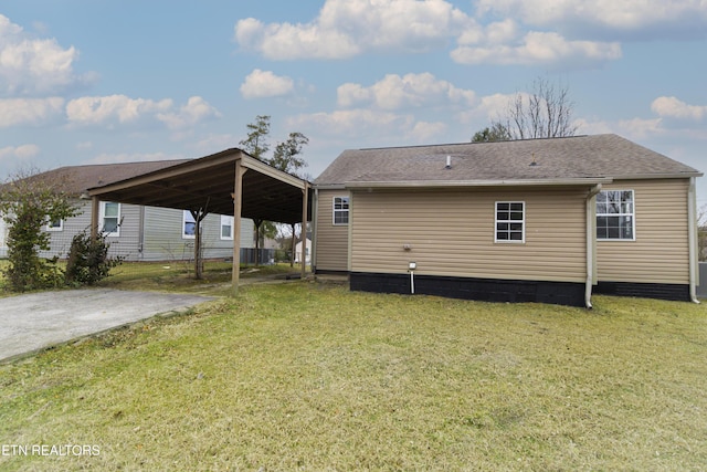 rear view of house with a yard