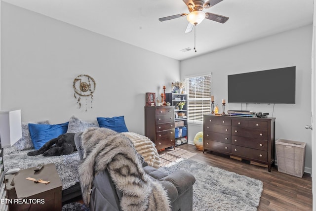 interior space with visible vents, ceiling fan, and wood finished floors