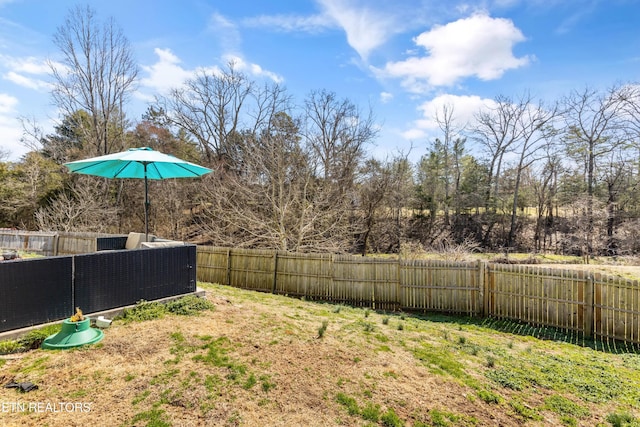 view of yard with a fenced backyard