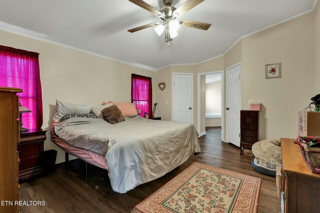 bedroom with dark wood-type flooring, ceiling fan, and crown molding