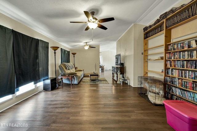 sitting room with ornamental molding, ceiling fan, and dark hardwood / wood-style flooring