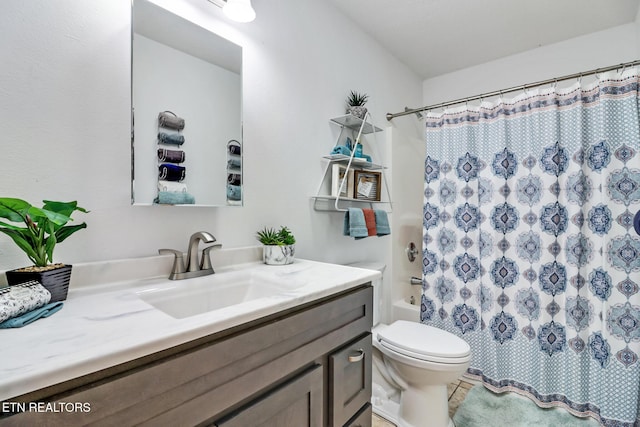 full bath featuring toilet, shower / tub combo, and vanity