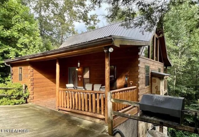 view of home's exterior featuring metal roof