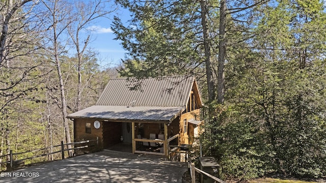 chalet / cabin featuring metal roof