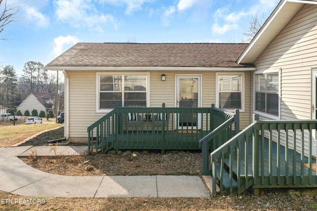 doorway to property featuring a wooden deck