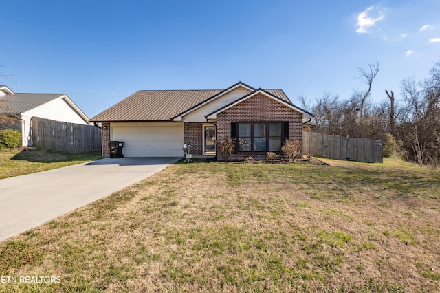 ranch-style home with fence, concrete driveway, a front yard, an attached garage, and brick siding