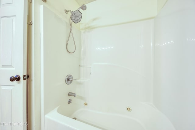 bathroom with shower / bath combination