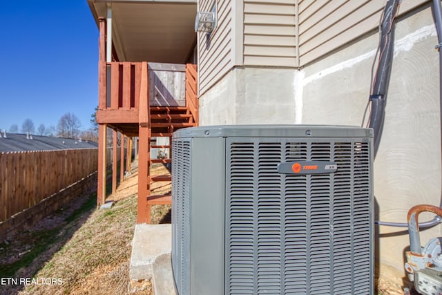 exterior details featuring a fenced backyard and central air condition unit