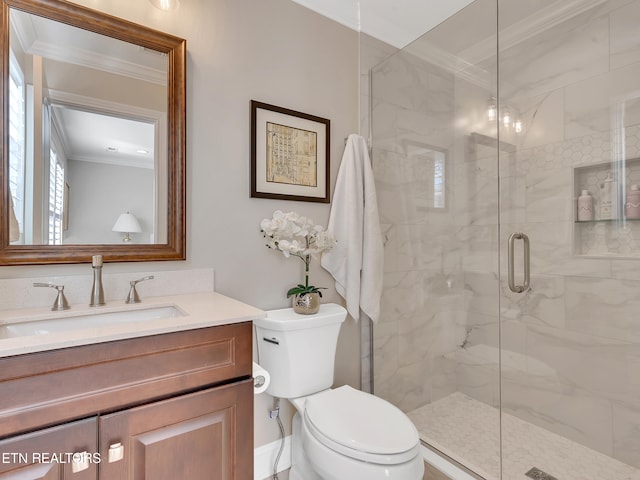 full bathroom with vanity, crown molding, toilet, and a marble finish shower