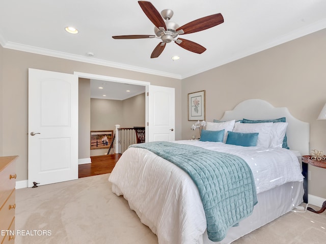 carpeted bedroom featuring recessed lighting, baseboards, ceiling fan, and crown molding