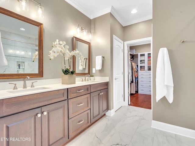 bathroom with a sink, marble finish floor, and crown molding