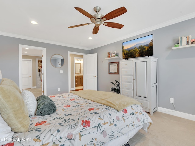 bedroom with ensuite bath, recessed lighting, crown molding, baseboards, and light colored carpet