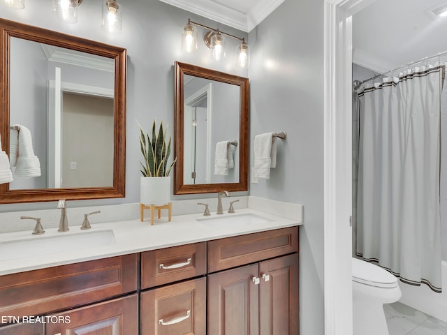 bathroom featuring double vanity, ornamental molding, and a sink