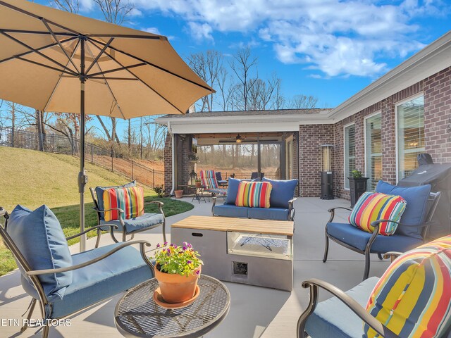 view of patio / terrace featuring outdoor lounge area and fence