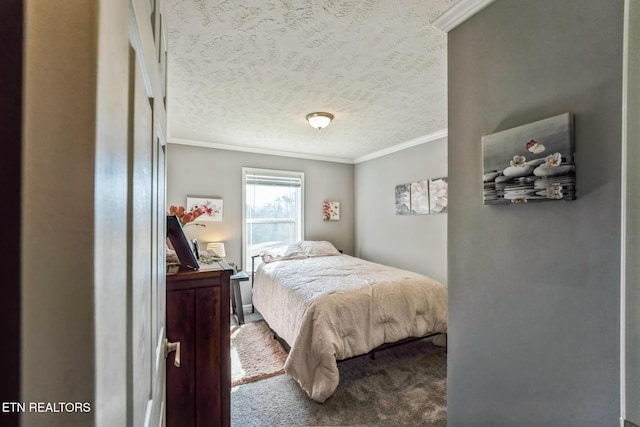 carpeted bedroom featuring a textured ceiling and ornamental molding