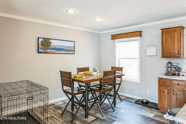 dining room featuring crown molding, dark wood finished floors, and baseboards