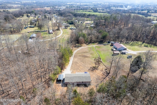 birds eye view of property featuring a rural view