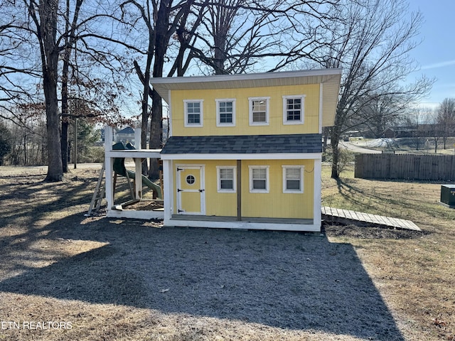 view of outbuilding with an outbuilding and fence