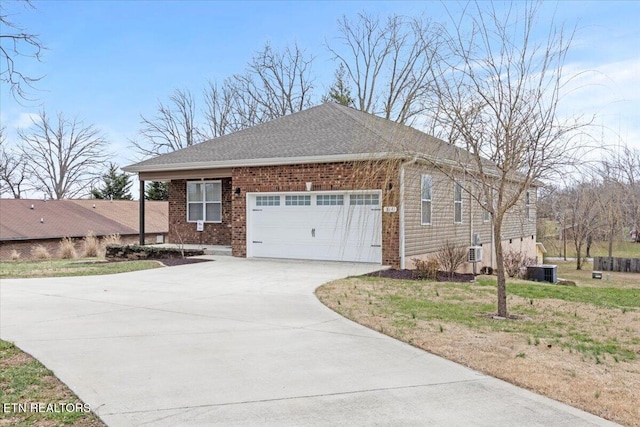 view of home's exterior with an attached garage, cooling unit, brick siding, a shingled roof, and concrete driveway