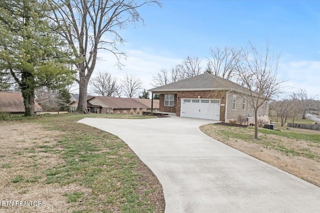 ranch-style house featuring a front lawn, concrete driveway, brick siding, and an attached garage