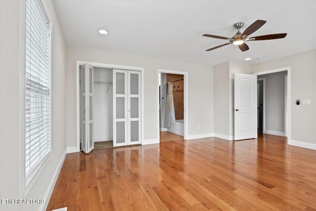 unfurnished bedroom featuring recessed lighting, a ceiling fan, baseboards, a closet, and light wood-type flooring