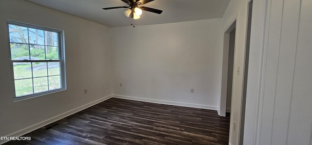 unfurnished bedroom with baseboards, dark wood-style floors, visible vents, and ceiling fan