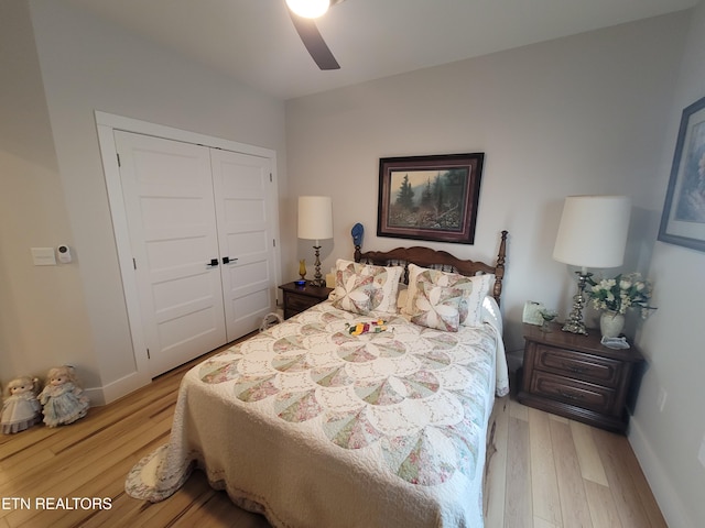 bedroom featuring a closet, baseboards, and light wood finished floors