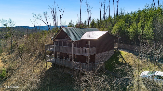 view of outdoor structure with a view of trees