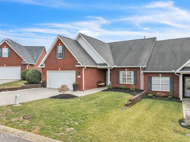 view of front of house featuring a front yard and a garage