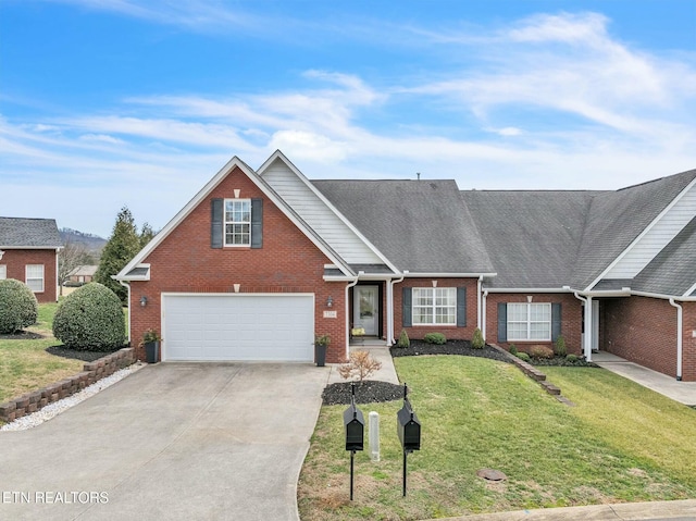 view of front of house featuring a garage and a front yard