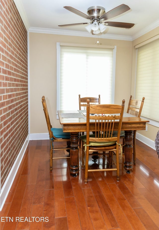 1017 Old Knoxville Hwy, Sevierville, TN 37862 - dining room with ornamental molding, brick wall, and wood-type flooring
