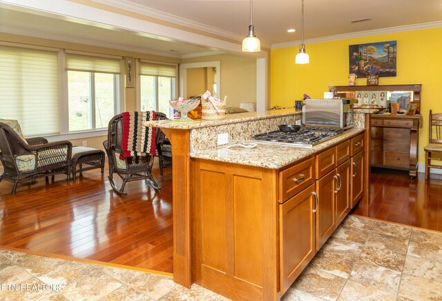 1017 Old Knoxville Hwy, Sevierville, TN 37862 - kitchen featuring stainless steel gas cooktop, a center island, light stone counters, and pendant lighting