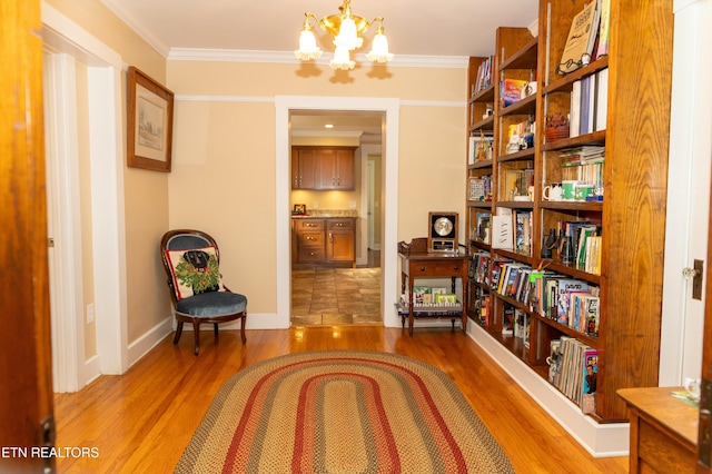 1017 Old Knoxville Hwy, Sevierville, TN 37862 - living area with light wood-type flooring, a chandelier, and crown molding