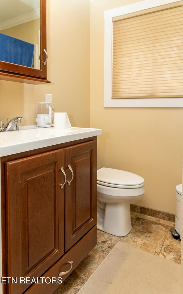1017 Old Knoxville Hwy, Sevierville, TN 37862 - bathroom with toilet, vanity, and crown molding