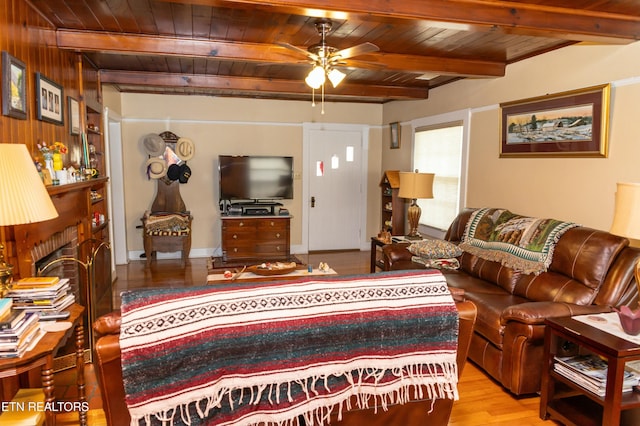 1017 Old Knoxville Hwy, Sevierville, TN 37862 - living room with a brick fireplace, light wood-type flooring, ceiling fan, wooden ceiling, and beam ceiling