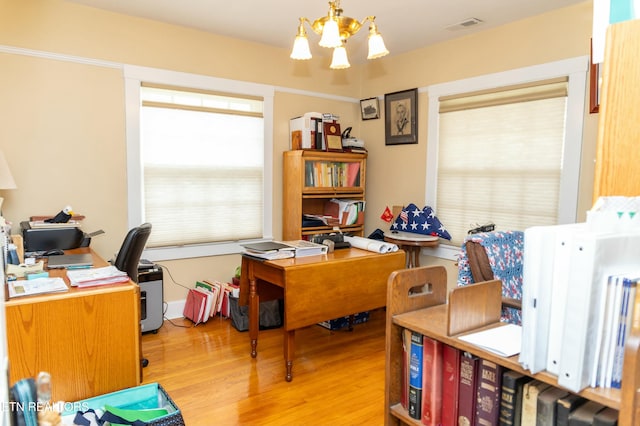 1017 Old Knoxville Hwy, Sevierville, TN 37862 - office area with a notable chandelier and light hardwood / wood-style floors