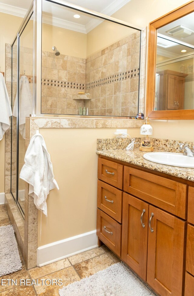 1017 Old Knoxville Hwy, Sevierville, TN 37862 - bathroom with ornamental molding, vanity, and a shower with door