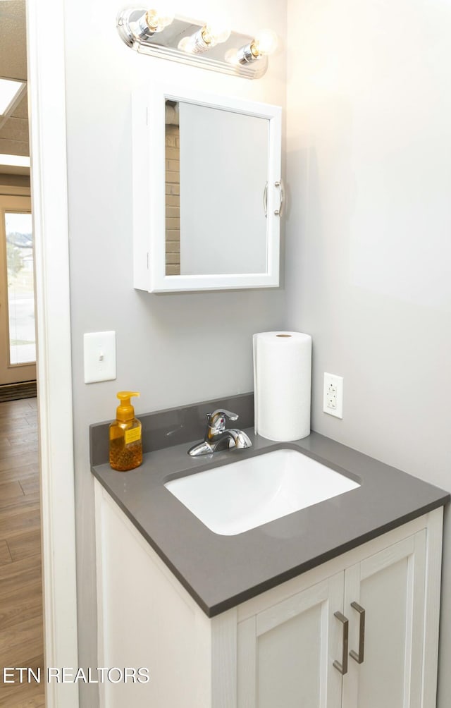 1017 Old Knoxville Hwy, Sevierville, TN 37862 - bathroom featuring vanity and wood-type flooring